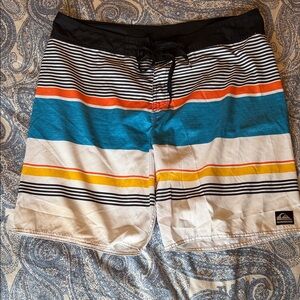 Quiksilver Men's Striped Board Shorts in Black, Blue, Orange, and Yellow